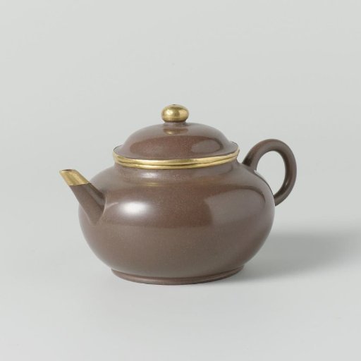 tea pot of red stoneware with gold rims