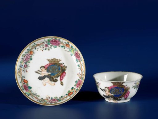 Saucer with a crowned monogram with putto and a bamboo border with floral scrolls