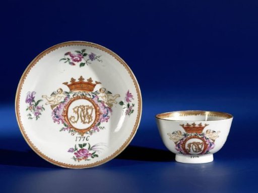 Cup and saucer with a crowned monogram and flower sprays