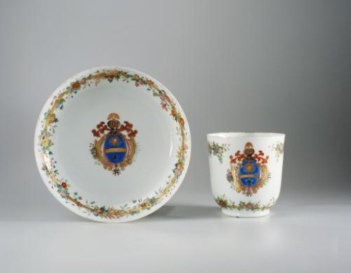Saucer with a coat of arms and bamboo border with floral scrolls