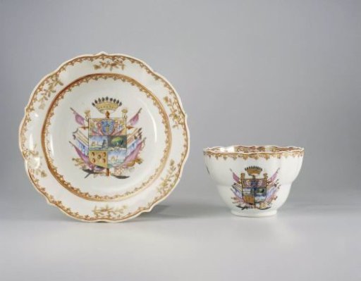 Cup with handle and saucer with a coat of arms, flower sprays and spearhead-borders