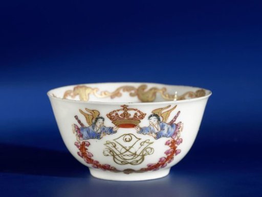 Bell-shaped cup with a monogram, flower spray and European border with a conch-motif