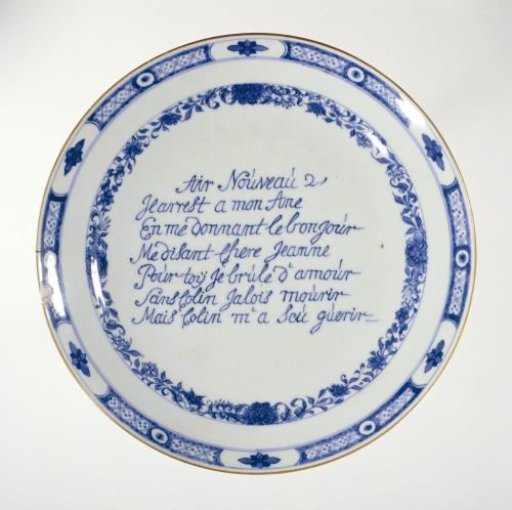 Saucer with an inscription in French