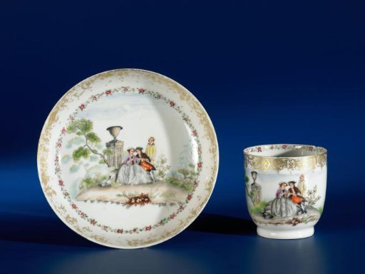 Saucer with an European couple sitting in a landscape