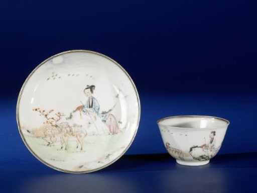 Bell-shaped cup and saucer with a shepherdess and two sheep in a landscape