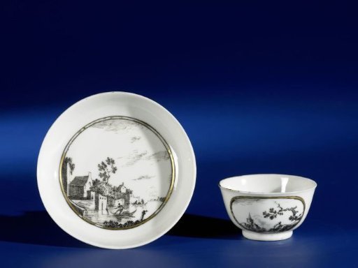 Bell-shaped cup and saucer with European landscapes in medallions