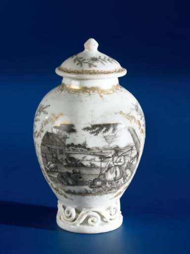 Ovoid tea caddy with a European country scene in two panels with flower sprays in between