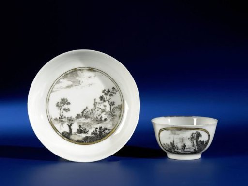 Bell-shaped cup and saucer with Dutch landschapes in medallions