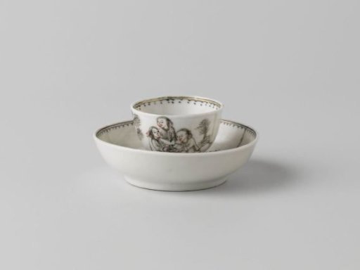 Cup and saucer with four people in a landscape