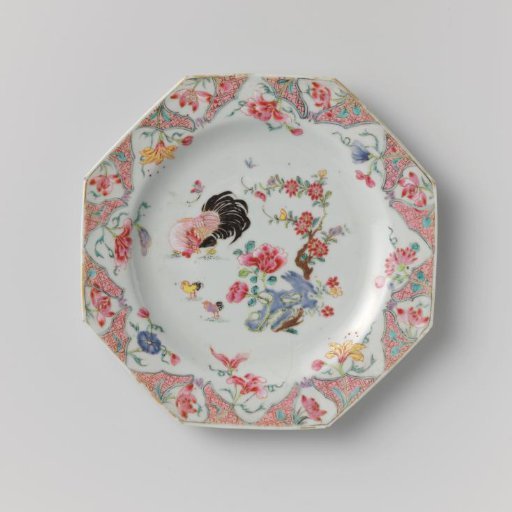 Octagonal plate with a cock and two little chickens near a rock with flowering plants