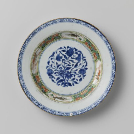 Plate with flower rosette and fish in panels