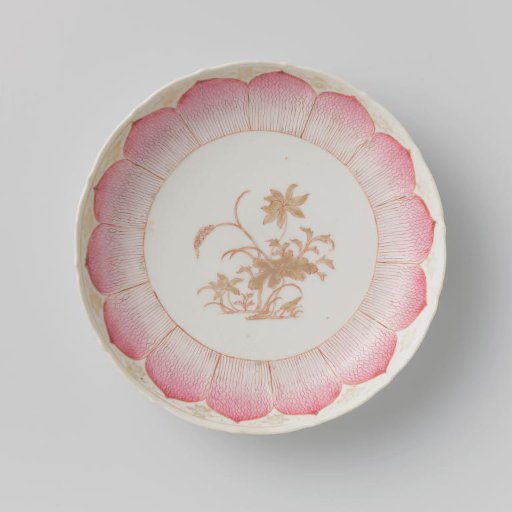 Saucer-dish with moulded petal-shaped petals, a flowering lotus and scrolls