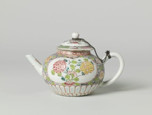 Squat, round-bodied teapot with flower sprays, scrolls and silver mount