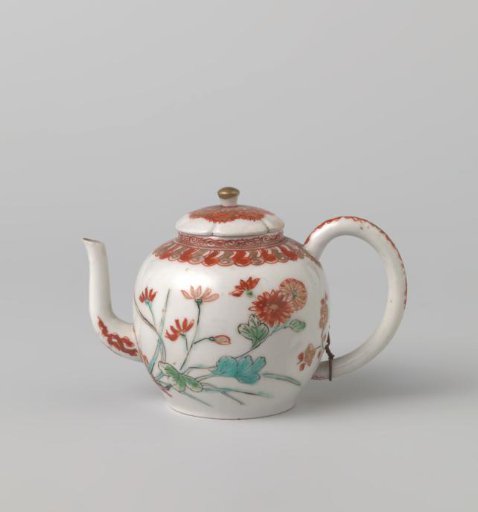 Teapot with flowering plants and ornamental borders