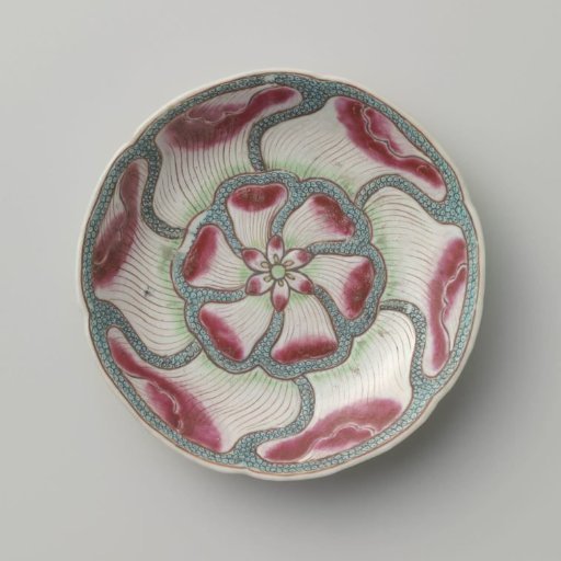 Saucer with undulating flower petals on diaper pattern and flower sprays