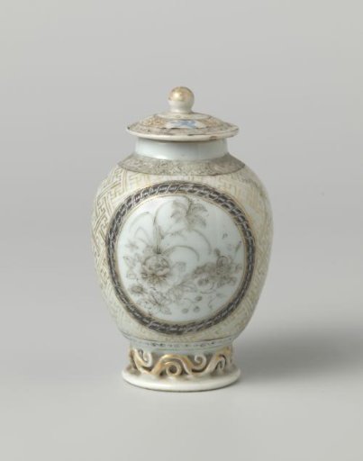 Cover of an ovoid tea caddy with flowering plants, swastika and diaper pattern