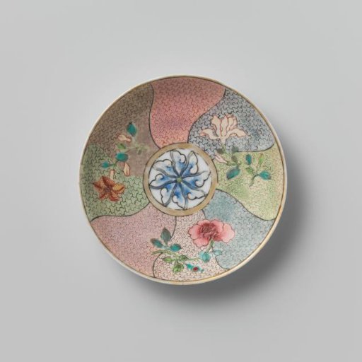 Saucer with three flower sprays on multi-colored diaper-pattern