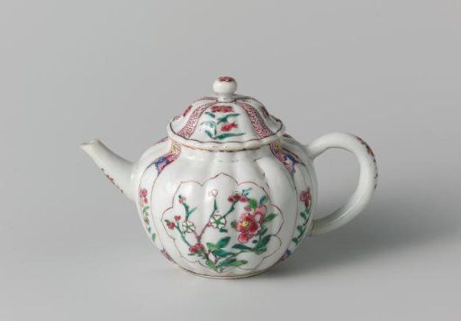 Fluted tea pot with flower sprays in panels