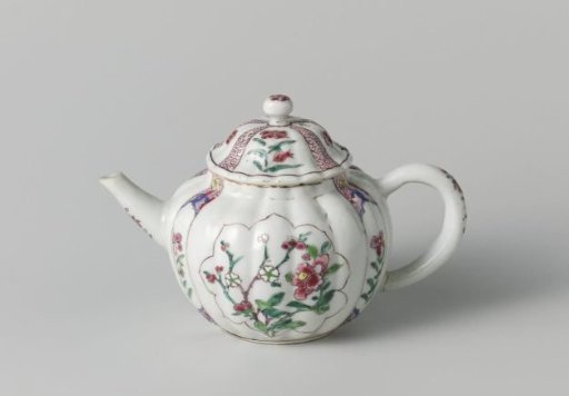 Fluted tea pot with flower sprays in panels