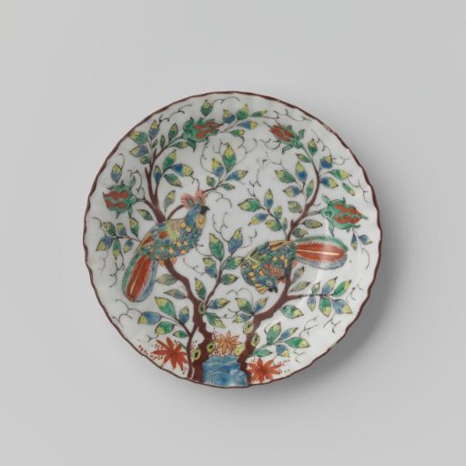 Saucer with fluted sides with two birds on flower sprigs near a rock