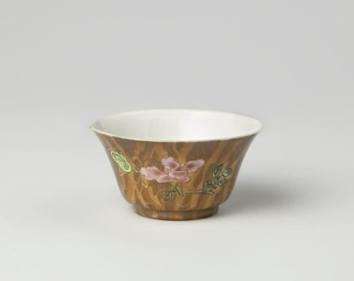 Cup with peony and antiquities on a wood-colored ground