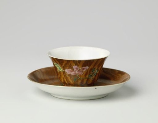 Cup and saucer with peony and antiquities on a wood-colored ground