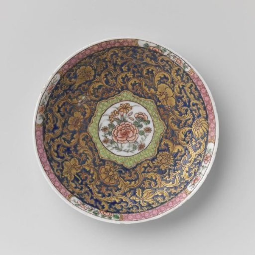 Saucer with large floral scrolls, diaper pattern and flower sprays