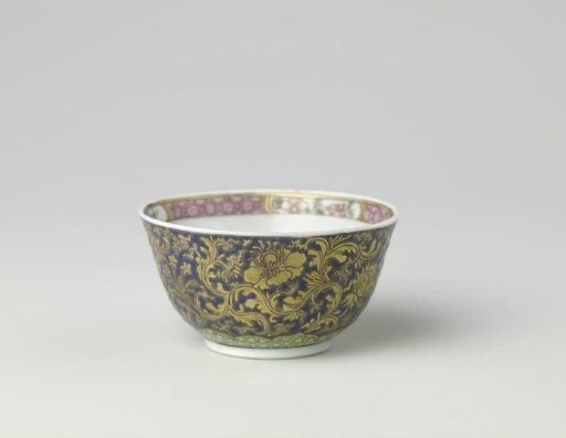 Cup with large floral scrolls, diaper pattern and flower sprays