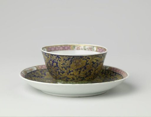 Cup and saucer and teapot stand with large floral scrolls, diaper pattern and flower sprays