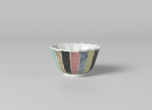Bell-shaped cup with a woman in a garden and diaper patterns on various colored grounds