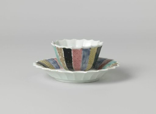 Bell-shaped cup and saucer with a woman in a garden and diaper patterns on various colored grounds