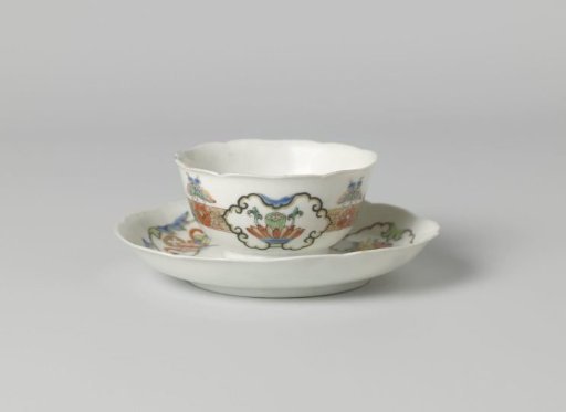 Bell-shaped cup and saucer with butterflies, floral scrolls and auspicious objects in panels