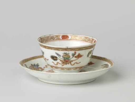 Bell-shaped cup and saucer with auspicious symbols and ornamental borders