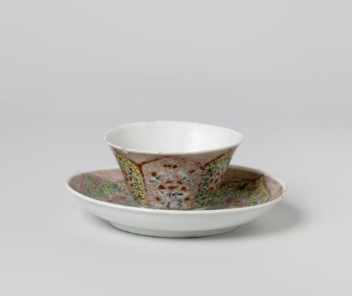 Cup and saucer with floral scrolls in petal-shaped panels