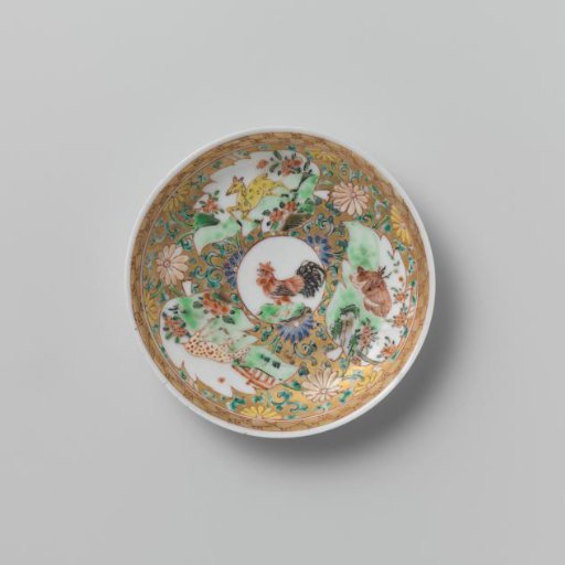 Saucer with a cock and three deer in panels on a gold ground with floral scrolls