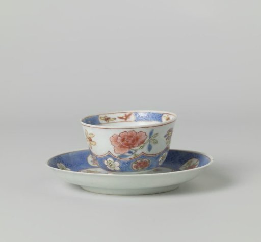 Cup and saucer with incised lotus scrolls and flowersprays in cartouches