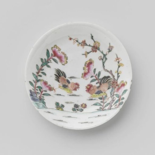 Saucer with two fighting cocks among flowering plants