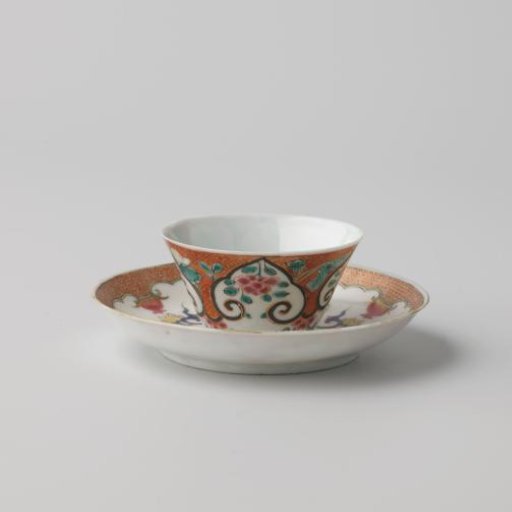 Cup and saucer with flower sprays and flowering plants on a diaper-pattern