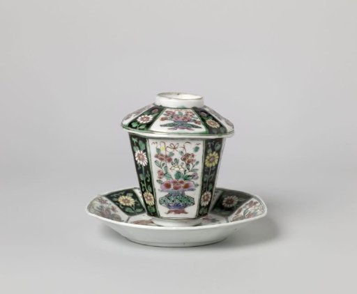 Covered cup and saucer with flower baskets and floral scolls