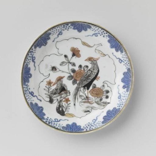 Saucer with two pheasants on a rock in a leaf-shaped panel