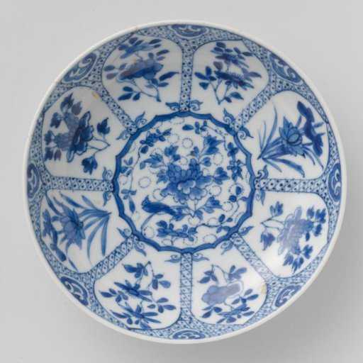 Saucer with flower sprays in a panel decoration