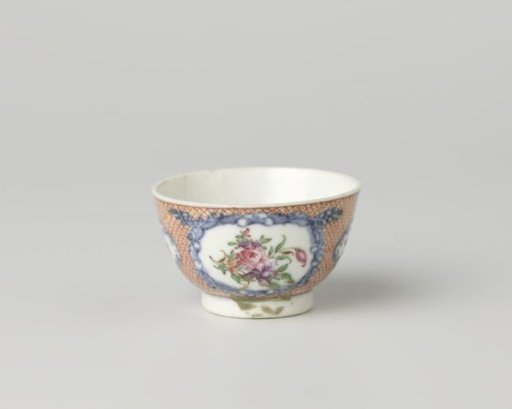 Cup with flower sprays in panels on a ground of red diaper pattern