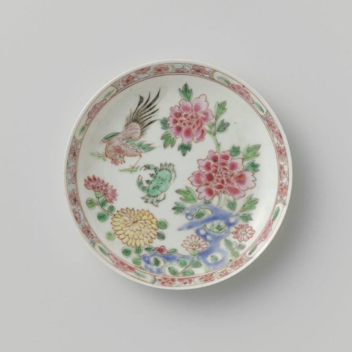 Saucer with a cock and crab near a rock with flowering plants