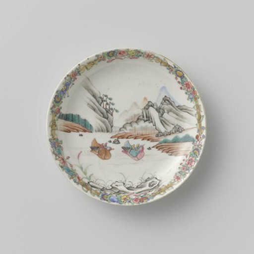 Saucer with two swimming ducks in a mountain landscape