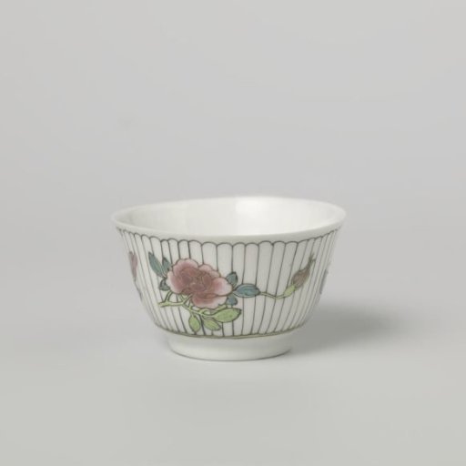 Bell-shaped cup with three flower sprays on a vertically striped ground