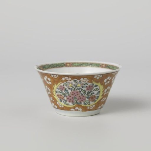 Cup with flower scrolls in panels against a red ground