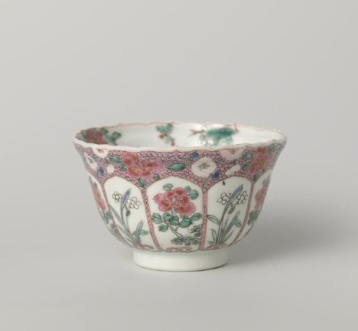 Bell-shaped cup with moulded petal-shaped panels, flowering plants and flower sprays