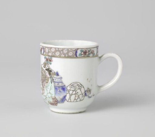 Cup with handle with two women at a table surrounded by objects