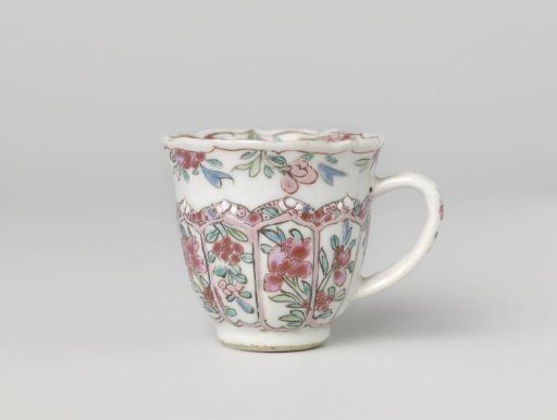 Cup with moulded petal-shaped panels with flower sprays