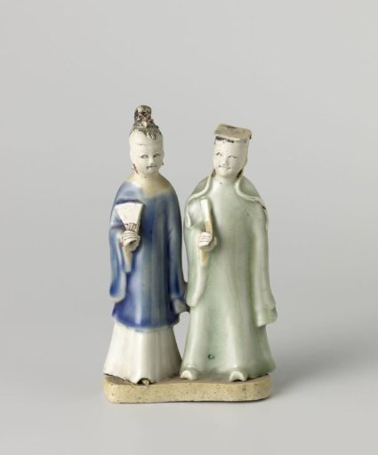 Figure of a standing man and woman with a fan
